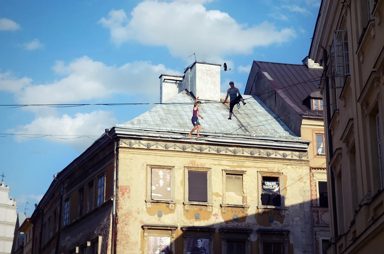 people, performers, adult, man, woman, show, stunts, wire, height, buildings, roofing, heaven, cloudiness. Action actors: how an action sequence is built and cut