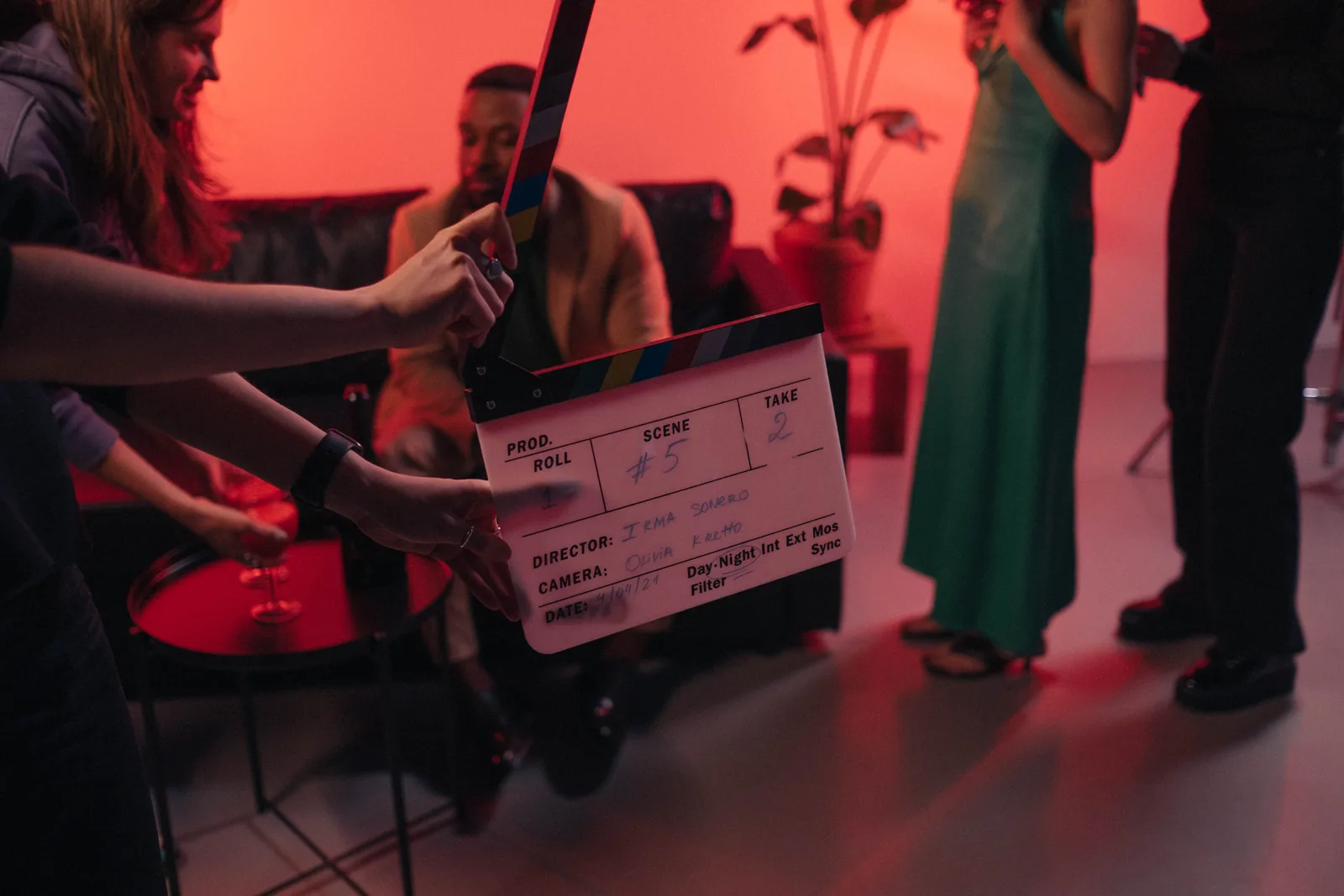 Behind the scenes of a movie set in a stylish indoor setting with clapperboard ready for action. Action actors by year as practitioners see it